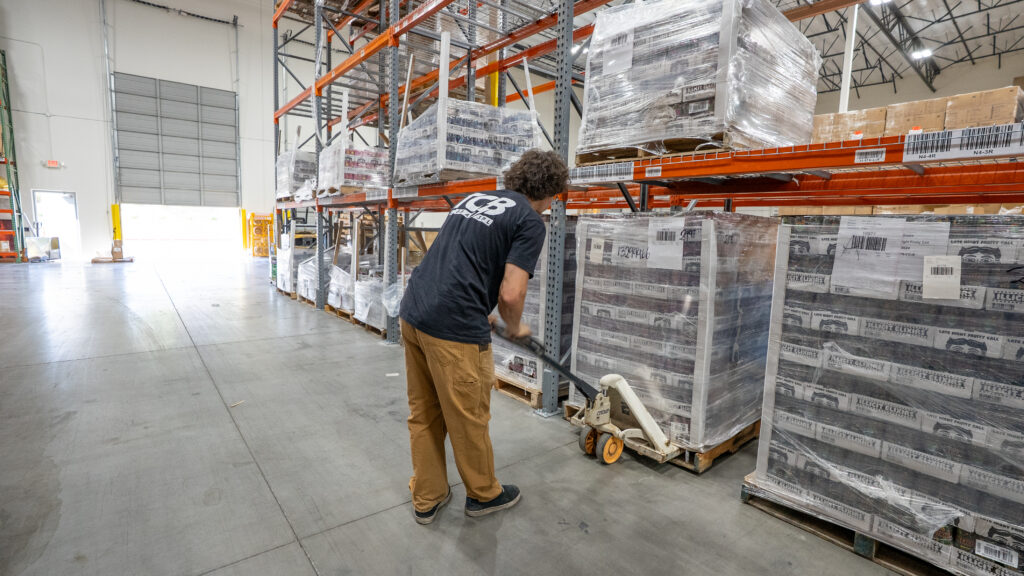 Warehouse workers scanning parcels